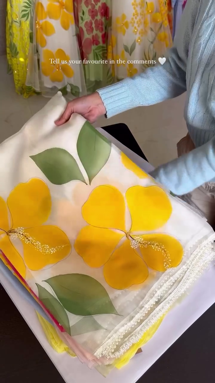 Hand-Painted Organza Sarees with Oversized Floral Motifs in Vibrant Yellow and Pink Tones – Featuring Delicate Pearl Detailing and Soft Sheer Finish, Perfect for Summer Celebrations, Festive Occasions