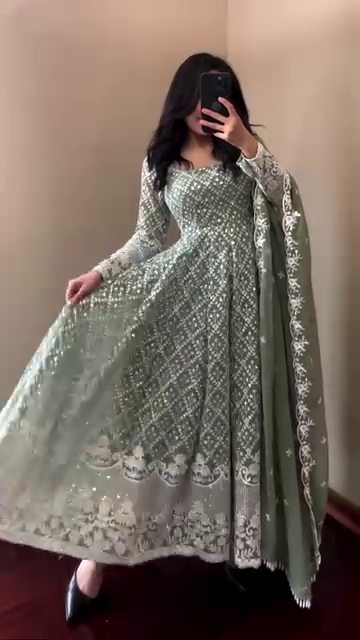Graceful and Elegant Green Floor-Length Anarkali Dress with Intricate Silver Embroidery and Lace Detailing, Paired with a Beautiful Flowing Dupatta