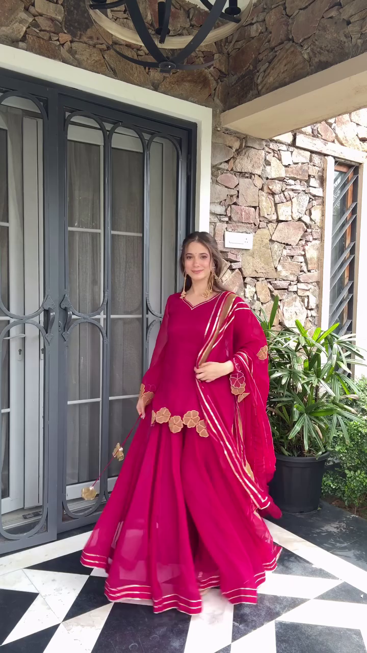 Elegant Maroon Anarkali Gown with Floral Embellishments, Embroidered Border, and a Matching Dupatta – Perfect for Weddings and Festive Occasions