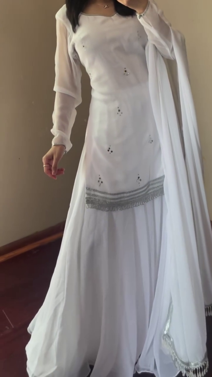 Elegant White Chiffon Anarkali Dress with Delicate Embellishments and Silver Detailing, Paired with a Flowing Dupatta for a Graceful Look