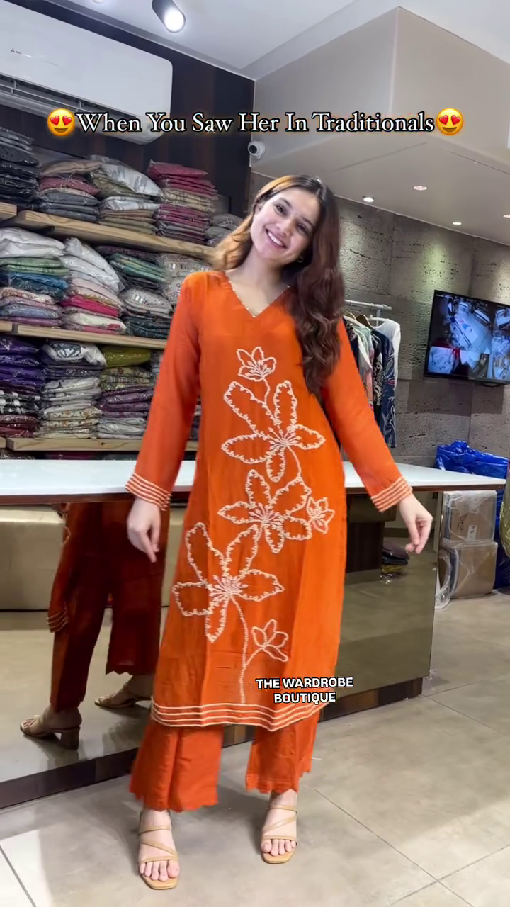 Vibrant Rust Orange Traditional Kurta Set Featuring Intricate White Thread Floral Embroidery, Full Sleeves, Flared Pants, and a Matching Sheer Dupatta – A Striking Ethnic Look for Festivals, Gatherings, and Cultural Occasions