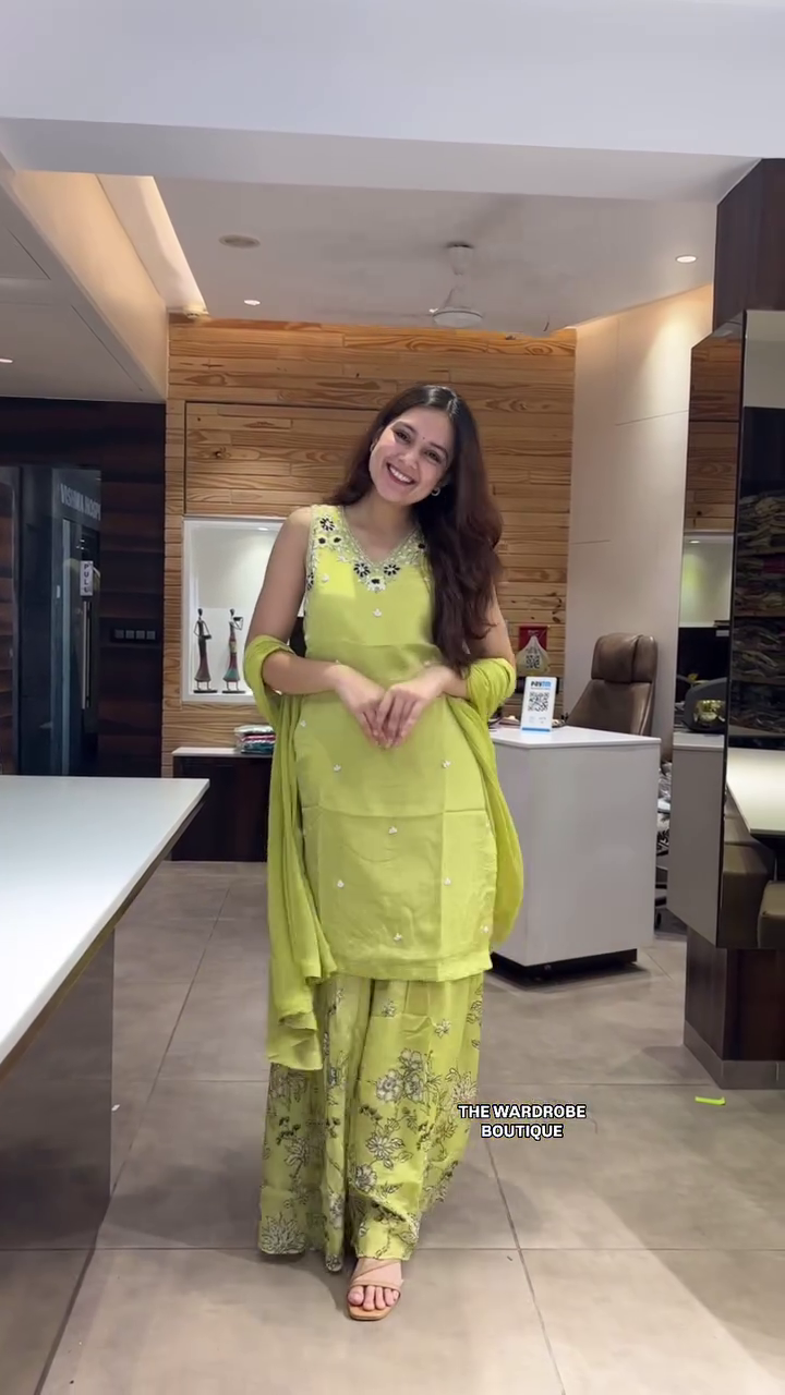 Graceful Indo-Western Ensemble Featuring an Embellished Sleeveless Kurta with Delicate Mirror Work, Paired with Flowy Floral Print Palazzo Pants and a Matching Dupatta