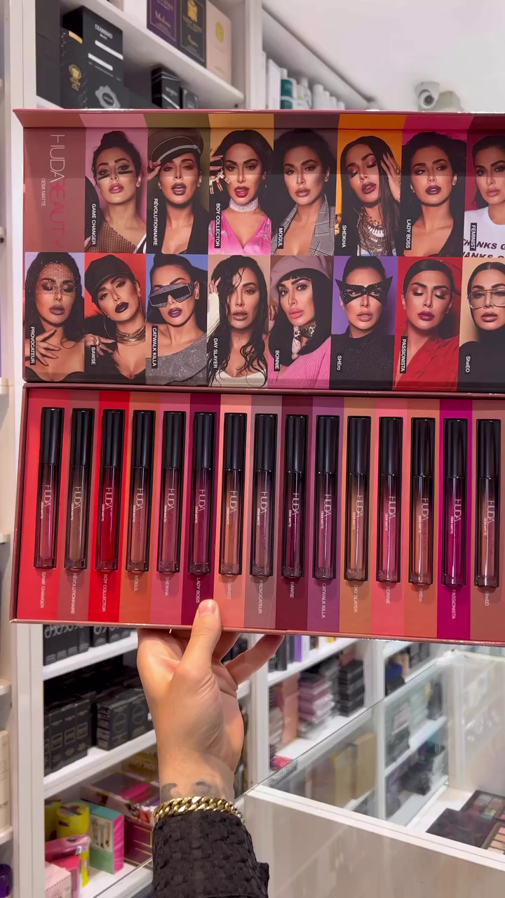 A gorgeous set of liquid lipsticks in various shades, ranging from bold reds to subtle nudes, perfect for creating diverse lip looks.