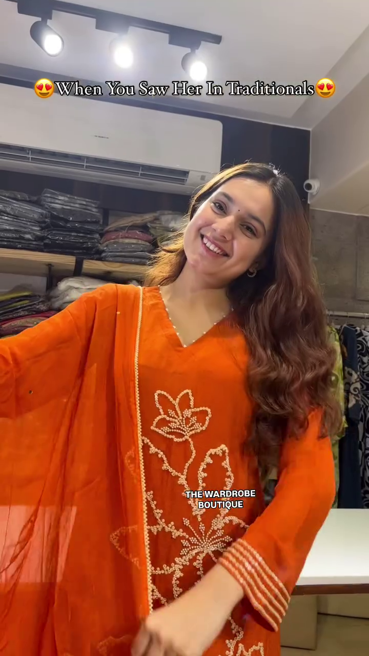 Vibrant Rust Orange Traditional Kurta Set Featuring Intricate White Thread Floral Embroidery, Full Sleeves, Flared Pants, and a Matching Sheer Dupatta – A Striking Ethnic Look for Festivals, Gatherings, and Cultural Occasions