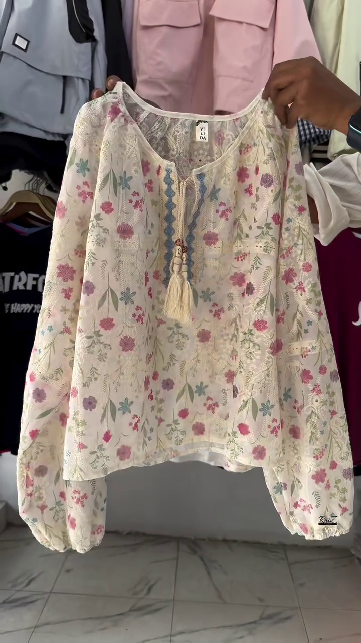 Bohemian Floral TOP Long Sleeve V-neck Top with Tassel Detail and Soft Floral Print in Pastel Hues for a Breezy, Casual Look