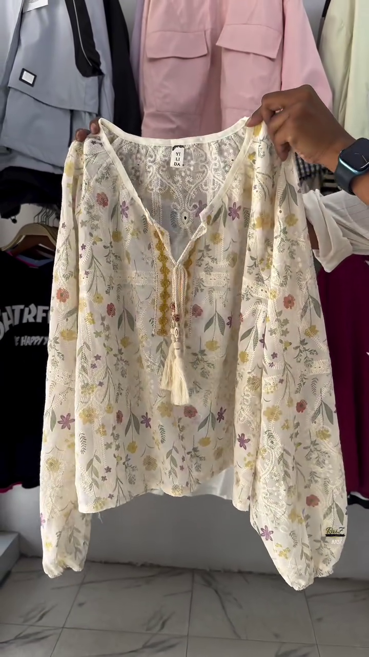 Bohemian Floral TOP Long Sleeve V-neck Top with Tassel Detail and Soft Floral Print in Pastel Hues for a Breezy, Casual Look