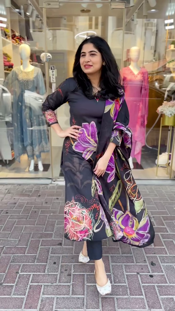 Elegant black kurta set with bold multicolor floral prints – A vibrant and graceful pick for festive days or stylish evening outings.