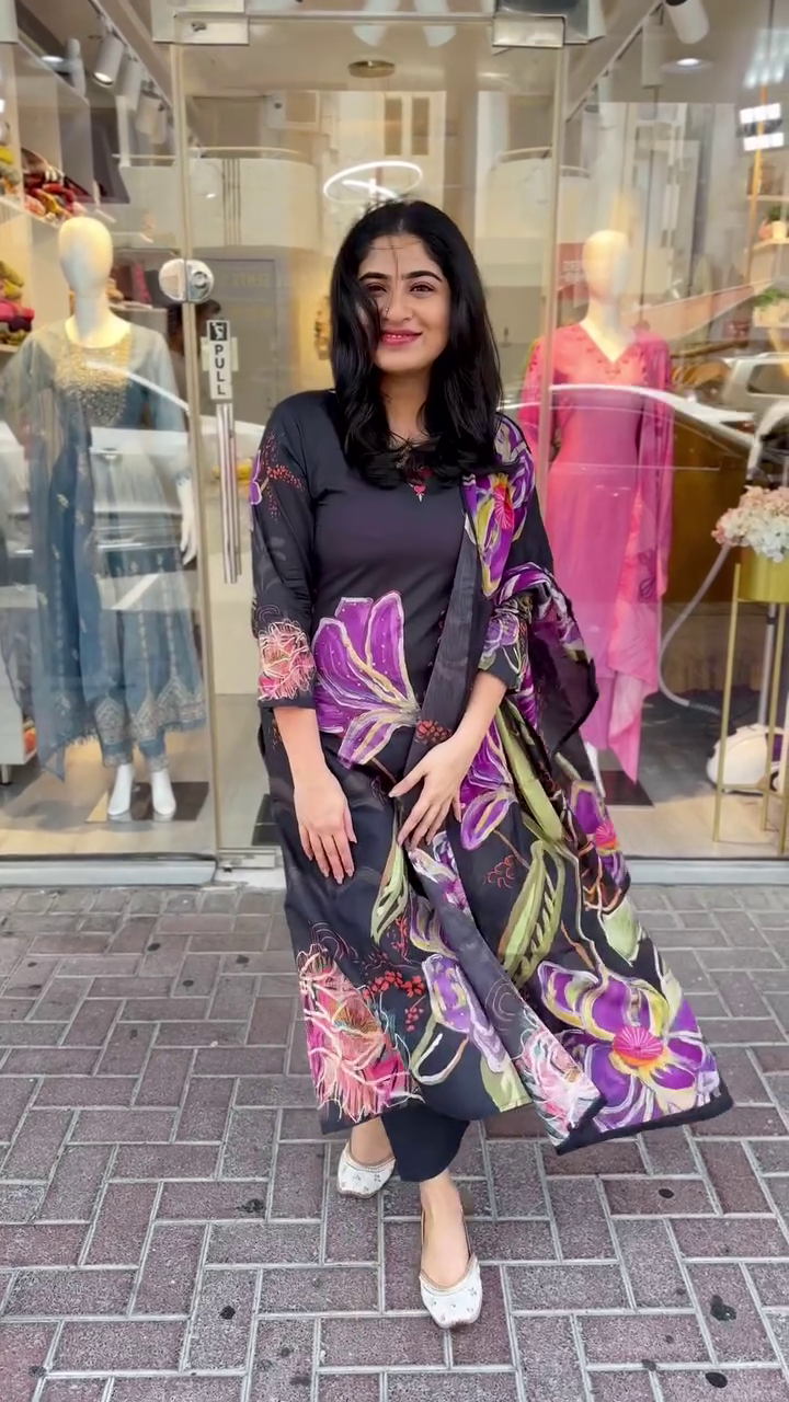 Elegant black kurta set with bold multicolor floral prints – A vibrant and graceful pick for festive days or stylish evening outings.