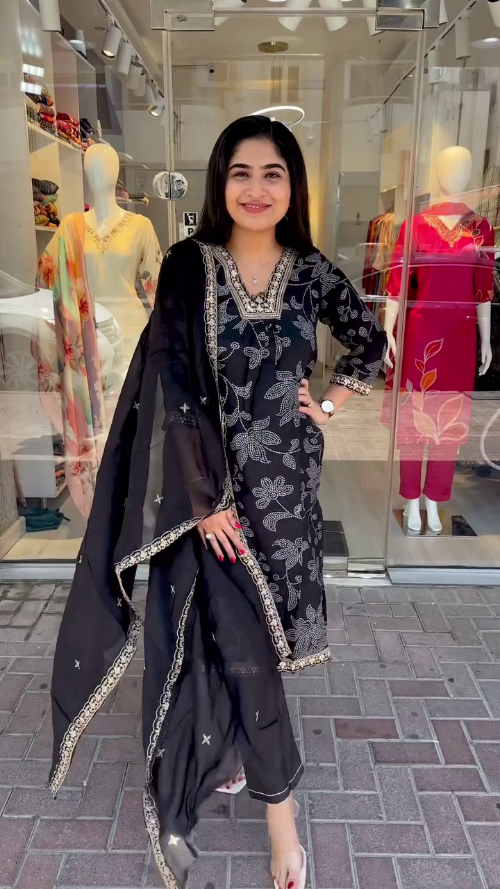 Elegant Black Suit Set Adorned with Silver Floral Embroidery and Mirror-Work Detailing – Paired with a Sheer Embellished Dupatta for a Timeless and Sophisticated Ethnic Look