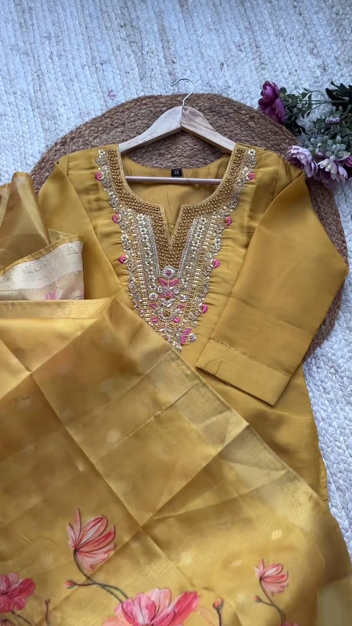 Graceful Mustard Yellow Kurta Set with Heavily Embellished Mirror and Thread Embroidery on Neckline, Paired with a Soft Silk Floral Printed Dupatta – Ideal for Festive Gatherings, Traditional Ceremonies, and Daytime Celebrations