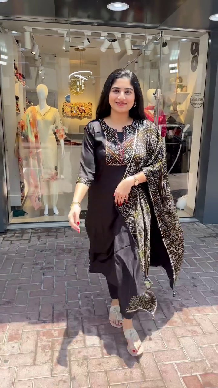 Chic Black Straight-Cut Suit Set Featuring Intricate Multicolor Thread Embroidery on Yoke and Sleeves, Paired with a Coordinated Printed Dupatta – A Striking Choice for Contemporary Festive and Casual Looks