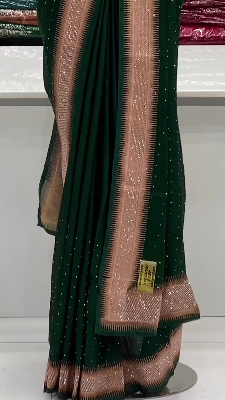 Dark Green Georgette Saree with Rose Gold Sequin Embellished Border and Subtle Stone Detailing for Festive and Party Wear