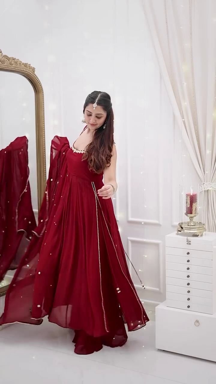 Graceful Deep Maroon Georgette Anarkali Set with Mirror Lace Detailing and Matching Sheer Dupatta – Sleeveless Flowing Silhouette with Subtle Embellishments, Ideal for Sangeet Nights, Festive Soirées, and Elegant Evening Celebrations