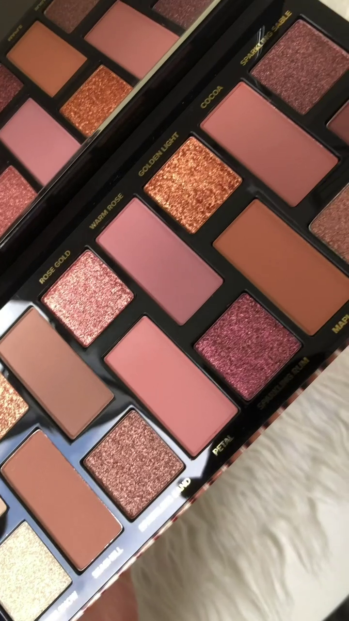 A stunning Too Faced eyeshadow palette featuring warm, shimmering shades like rose gold, golden light, and sparkling rum — perfect for creating a glamorous look!