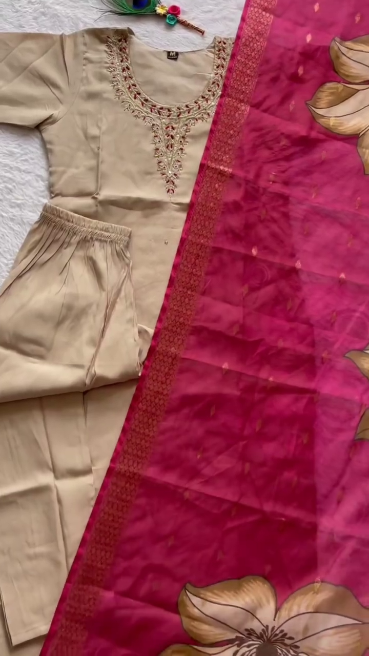 Elegant Beige Ethnic Suit Set Featuring Delicately Embroidered Neckline and Comfortable Straight Pants, Paired with a Striking Pink Dupatta Adorned with Bold Floral Prints and Rich Woven Border – Perfect for Traditional Occasions and Festive Celebrations