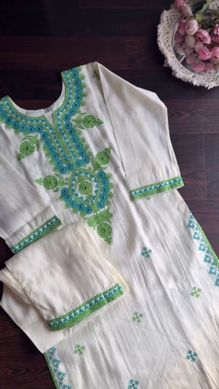 Off-White Cotton Kurta Set Featuring Intricate Green and Blue Thread Embroidery with Mirror Accents, Paired with a Coordinated Embroidered Dupatta and Matching Bottom – Perfect for Ethnic Festive and Summer Wear