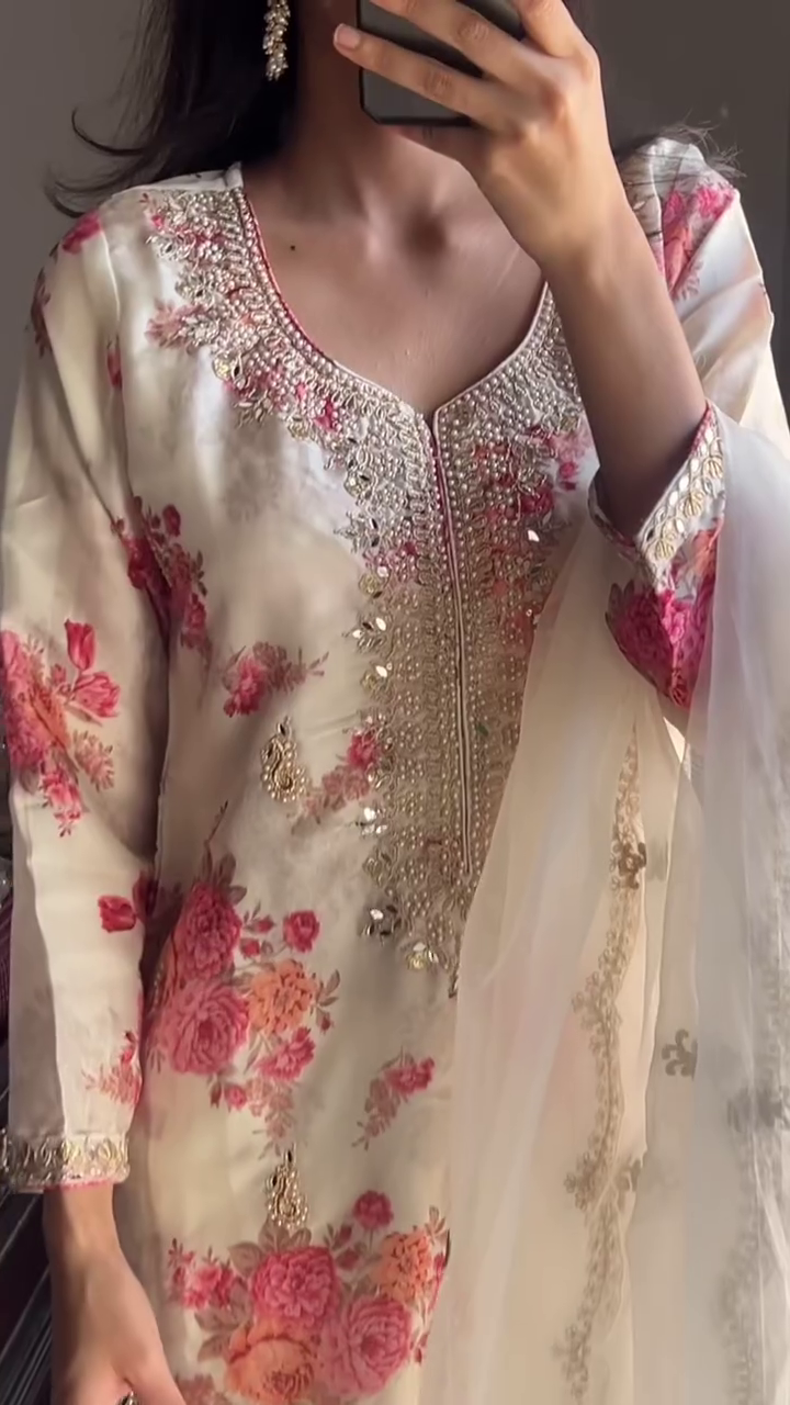 Graceful Off-White Floral Printed Kurta Set Featuring Intricate Handwork and Mirror Embellishments on the Neckline, Paired with a Sheer Embroidered Dupatta – Perfect for Elegant Festive and Occasion Wear