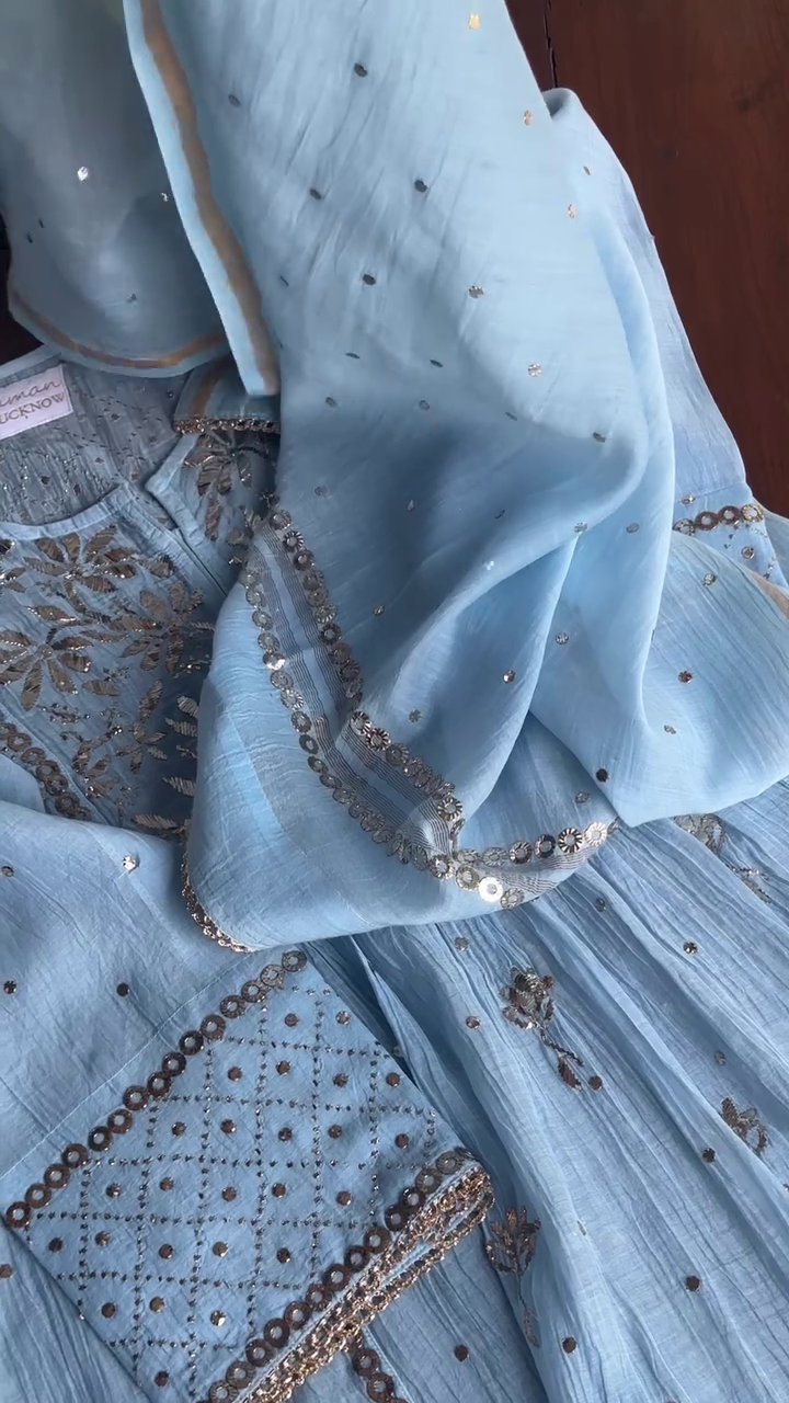 Elegant sky blue kurta with golden floral embroidery and sequin highlights. Crafted from soft crinkled fabric, perfect for festive and semi-formal occasions.
