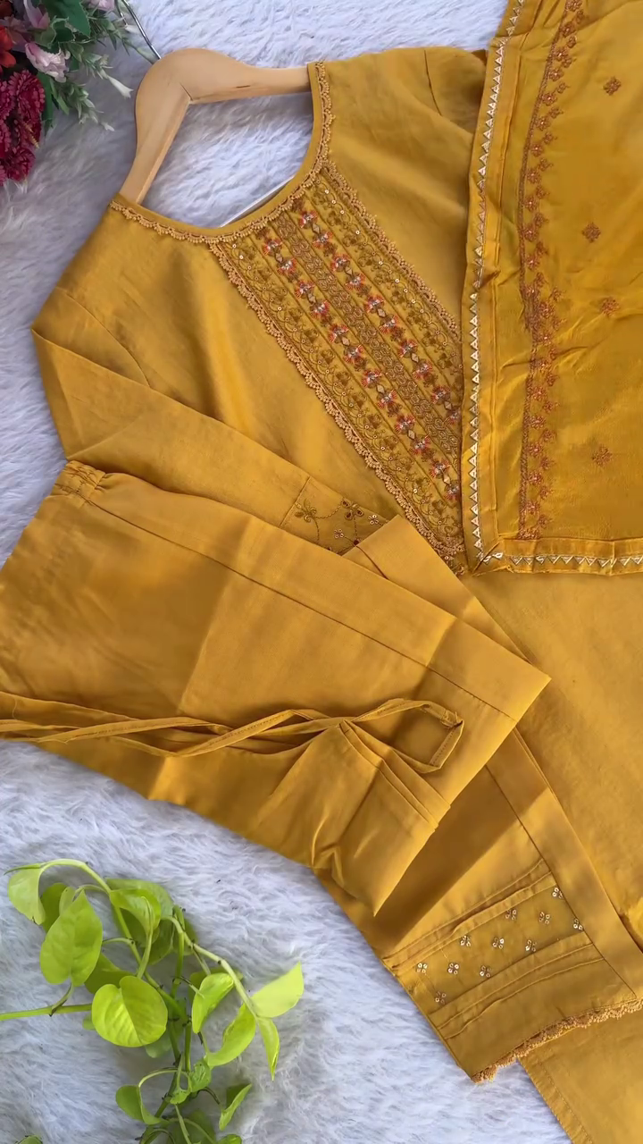 Mustard Yellow Ethnic Kurta Set Intricately Embroidered Neck Panel with Sequin Work, Paired with Matching Embellished Straight Pants and Dupatta with Detailed Border and Floral Accents – Perfect for Traditional Occasions