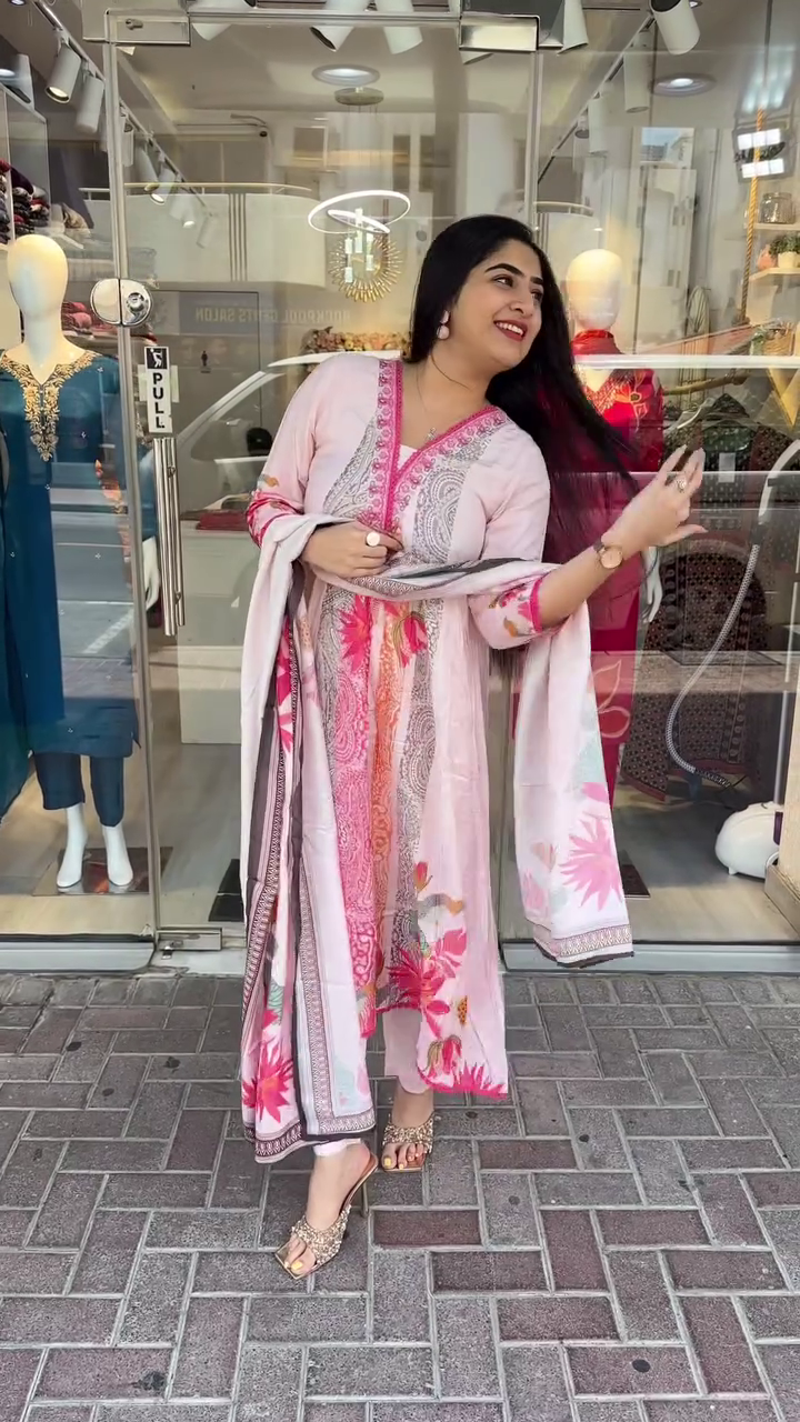 Light Pink Printed Cotton Suit Set Featuring Intricate Paisley and Floral Designs on Kurta with Embroidered Neckline, Paired with Matching Straight Pants and Contrasting Printed Dupatta – A Stylish and Comfortable Choice for Casual and Semi-Ethnic Outings