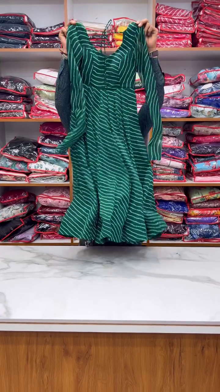 Elegant Green Bandhani Print Anarkali Kurta Set with Matching Dupatta and Solid Pants – Flowy Flared Design, Button Detailing, Full Sleeves, and Ethnic Chic Look – Perfect for Festive, Wedding, and Party Wear