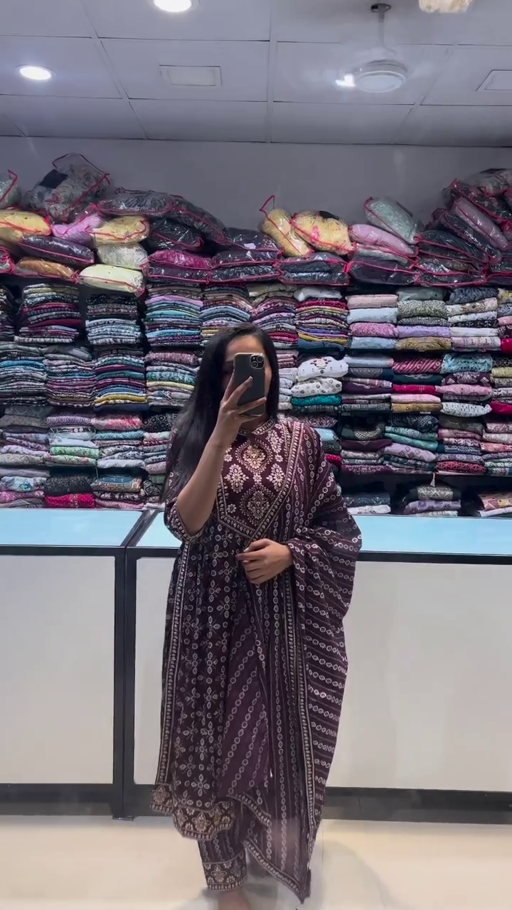 Elegant maroon ethnic set featuring intricate traditional motifs in beige. Complete with a matching dupatta and churidar, this suit exudes classic charm for everyday or festive wear.