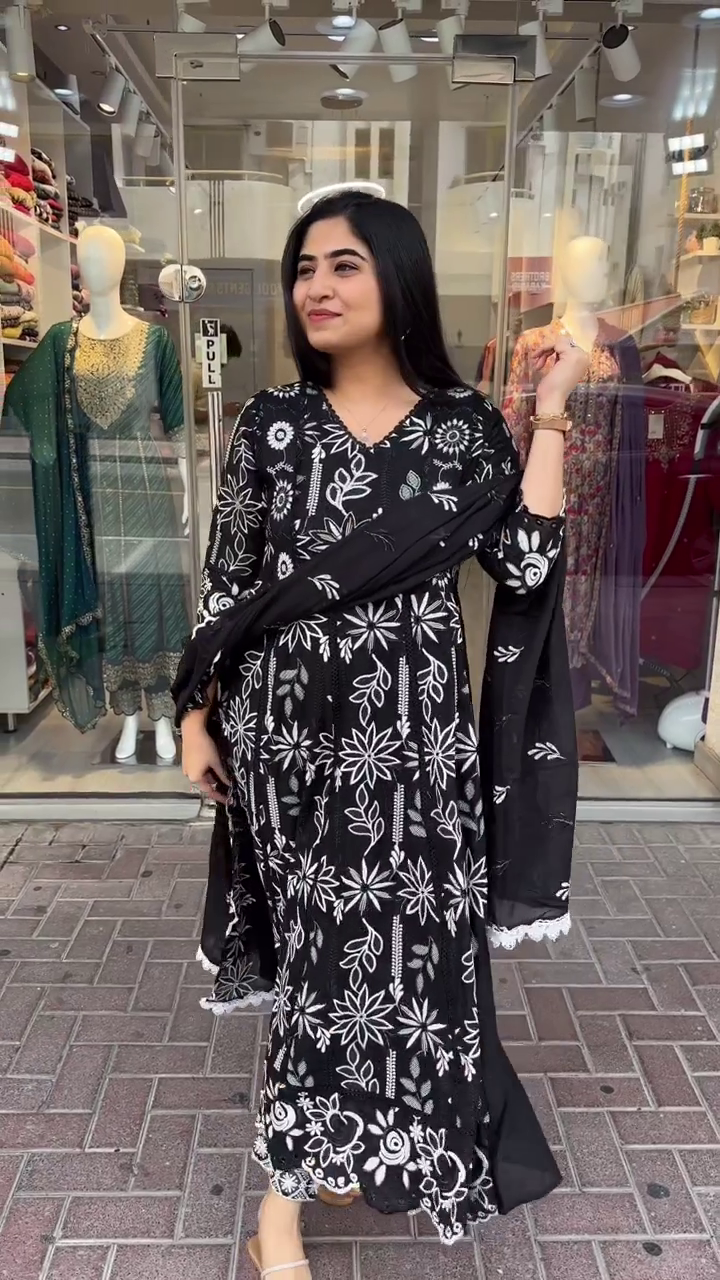 Black Anarkali Kurta Set with Intricate White Floral Thread Embroidery, Scalloped Hemline and Sleeves, Paired with Coordinated Printed Dupatta – A Striking Ethnic Ensemble Perfect for Festive Gatherings and Elegant Daywear