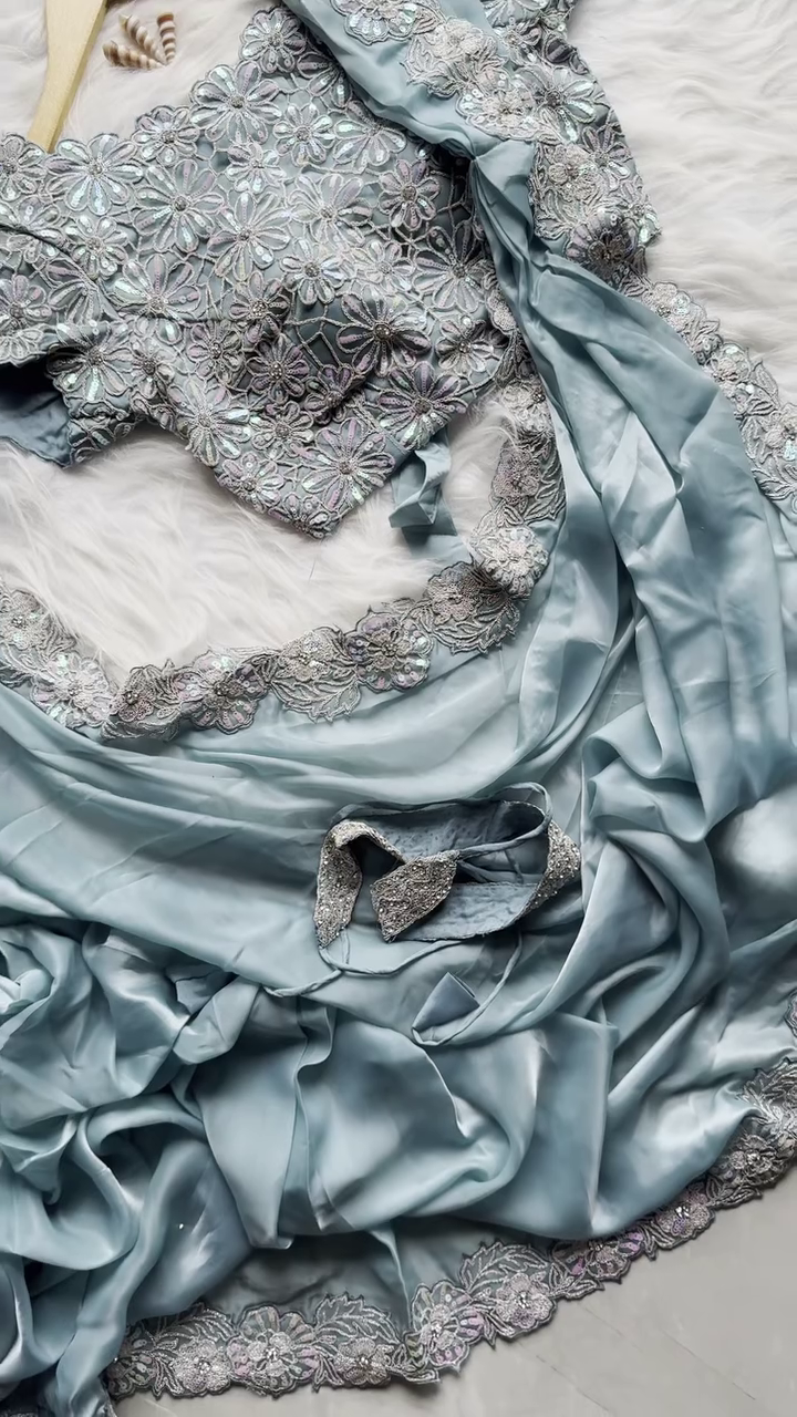 Pastel Blue Satin Saree with Sequin Floral Embroidered Blouse and Lace Border Detailing – Perfect for Wedding, Party, or Festive Occasions