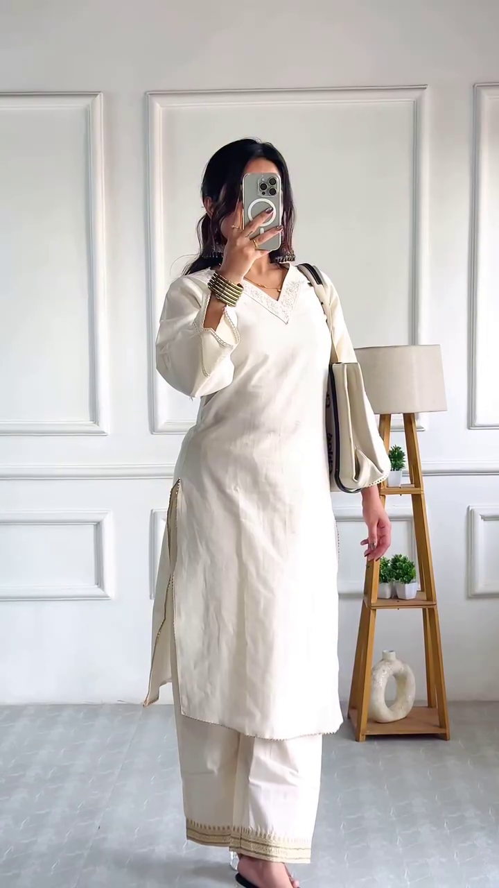 Halter-Neck Flared Indo-Western Jumpsuit with Layered Detailing and Chic Sleeveless Design Paired with Printed V-Neck Anarkali Kurti Featuring Floral Motifs and Blue Striped Pants for a Contemporary Ethnic Look