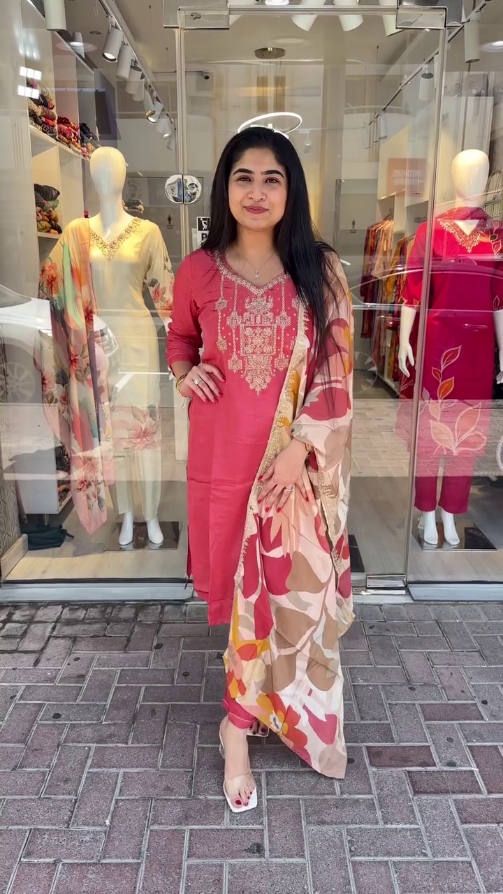 Graceful Coral Pink Suit Set with Delicate Golden Thread Embroidery and a Bold Multicolor Floral Printed Dupatta – A Perfect Blend of Elegance and Vibrance for Festive and Daytime Occasions