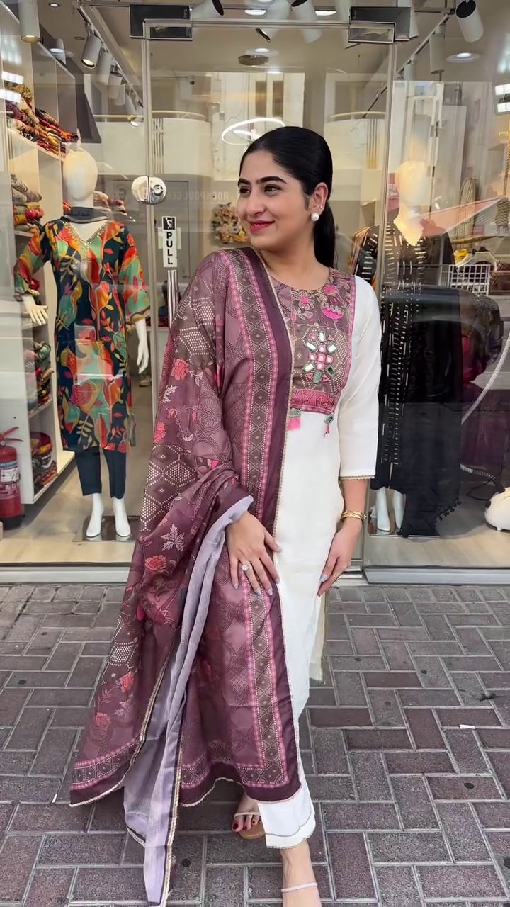 Chic Cream Suit Set Featuring Vibrant Multicolor Thread Embroidery on the Yoke Paired with a Rich Printed Silk Dupatta – A Perfect Fusion of Modern Grace and Traditional Artistry