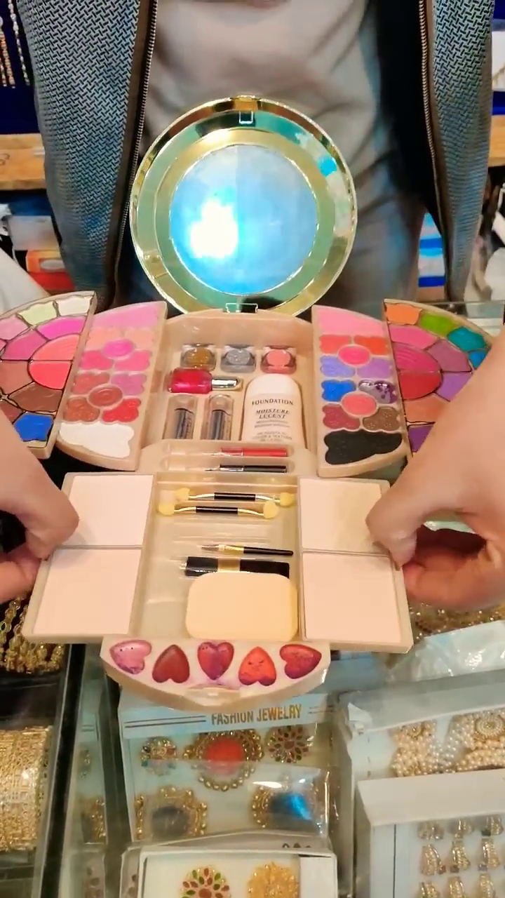 Colorful Butterfly-Inspired Makeup Kit with Eyeshadows, Lipsticks, Foundation, Brushes, and Mirror for Creative Beauty Applications