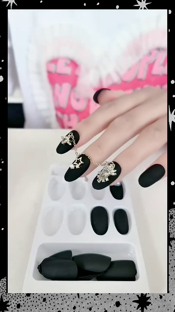 Black Matte Press-On Nails with Stylish Star and Heart Charm Accessories for Trendy and Glamorous Manicures